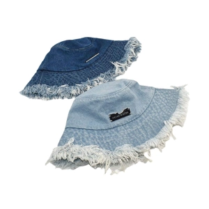 Frayed denim bucket hat set in dark and light blue wash for outdoor sun protection