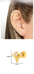 Detail view of 0.7cm gold star stud earring with zircon inlay and screw ball back