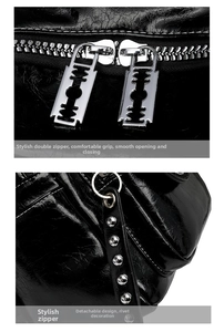 Detail of dual metal zippers with razor blade pulls and silver studs on black leather bag