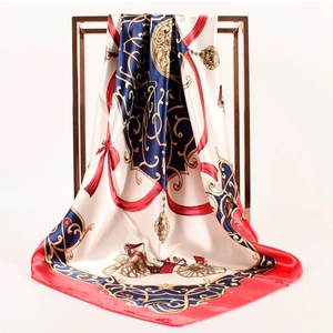 Detailed close-up of silk-satin scarf with vintage carriage print draped on metal frame
