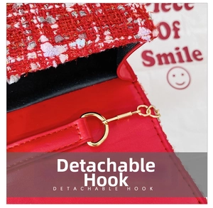 Detail view of the gold detachable hook and chain on the red tweed girls crossbody bag