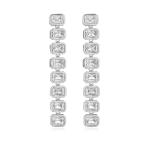 Macro shot of silver rectangular-cut crystal earrings with premium brilliant finish