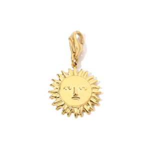 Detailed macro view of a golden sun face pendant with a secure lobster clasp attachment