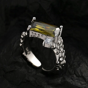 Textured S925 silver ring with emerald-cut green gemstone and white zircon accent