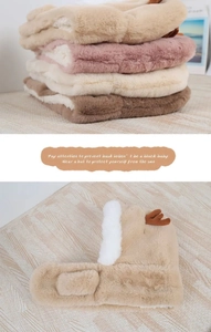 Close-up of plush reindeer earflap hats showing soft faux fur texture and antler details
