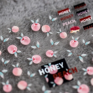 Watermelon peach themed nail art stickers with honey peach patterns on soft plush fabric