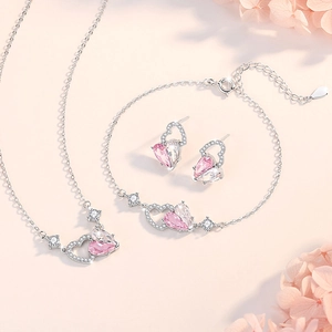 Elegant 925 sterling silver jewelry set featuring pink heart pendants with cubic zirconia