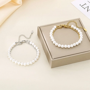 Elegant double-layer pearl necklace and bracelet set in silver and gold stainless steel