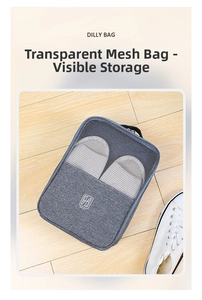Detail of travel shoe bag with mesh window and handle on wooden floor background