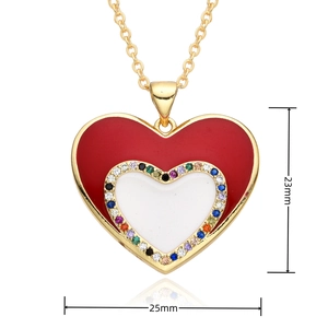 Detail of vintage heart pendant with red enamel, colorful zircons and size measurements