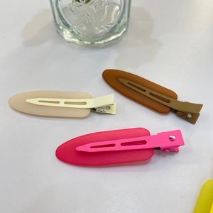 Three-piece matte candy color hair clips set in cream, brown, and pink resin duckbill style