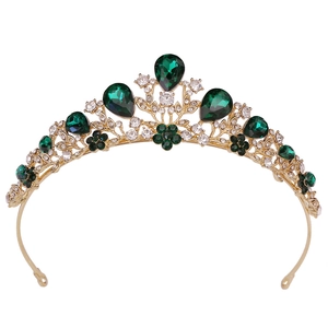 Elegant gold bridal crown with dark green teardrop gemstones and leaf patterns