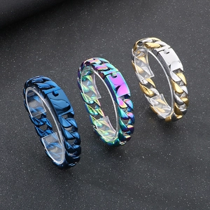 Detailed shot of 15mm Cuban link bracelets in blue, rainbow, and gold-silver steel