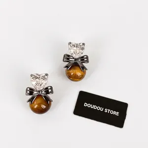 Vintage heart earrings with silver needle, tiger eye stone and black bow accents