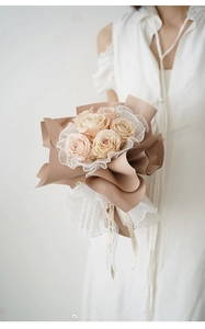 Detail of floral bouquet with pleated pearl lace wrap and Korean style wave edge gauze
