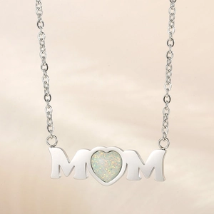 Macro detail of MOM heart pendant with iridescent opal inlay in silver stainless steel