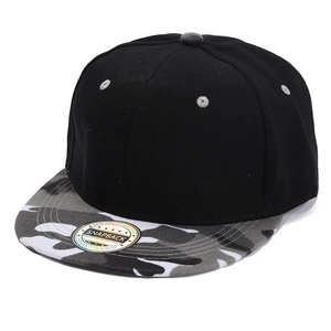Detail of a black snapback cap featuring a grey camouflage flat brim and reflective sticker