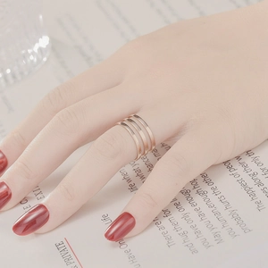 Detailed view of luxury rose gold multi-layer open ring for women on an elegant background