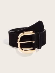 Close-up of a wide black vintage leather belt with a polished gold semicircular buckle