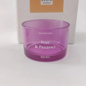 Purple glass aromatherapy oil diffuser jar with white Home & Fragrance printed text