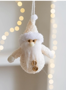 Detail of plush white Santa Claus hanging doll with wooden buttons and fuzzy texture