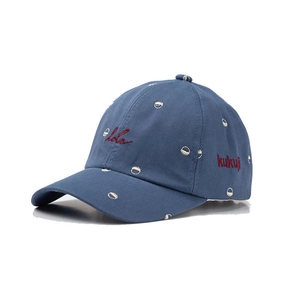 Blue cotton baseball cap with red hola embroidery and white circular patterns