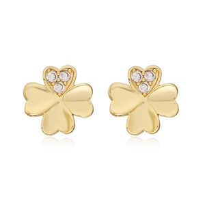Macro detail of 18K gold plated four-leaf clover stud earrings with clear zircon stones