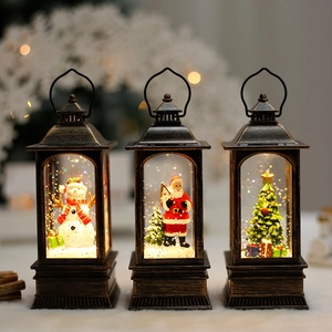 Three bronze Christmas lanterns with Snowman, Santa, and LED lights for festive decor