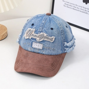 Vintage denim baseball cap with New York 1985 embroidery and distressed brim details