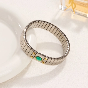 Elastic stainless steel stretch bracelet featuring a green gemstone and 18K gold accents