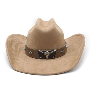 Detail of western cowboy hat with brown leather band, turquoise beads and bull head emblem