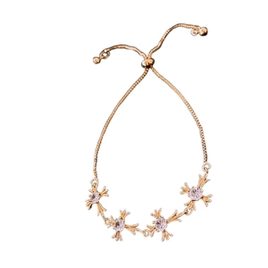 Adjustable gold bracelet with gothic zircon cross charms and pull-string slider clasp