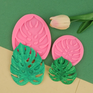 Macro view of pink silicone monstera leaf molds for fondant and chocolate DIY decorating