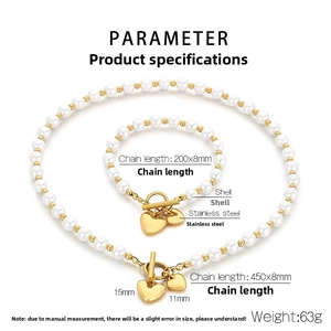 Detail view of heart pendant pearl necklace and bracelet set with size specifications