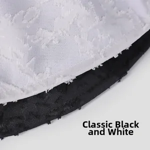 Detail der eleganten Jacquard-Spitzentextur in den Farben klassisch Schwarz und Weiß