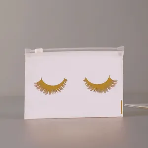 Frosted translucent cosmetic bag with gold eyelash design and white zipper closure