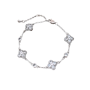 French style silver bracelet with four zircon flower charms and round cubic zirconia stones