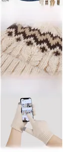 Detail of winter knit set showing touch screen gloves and warm geometric pattern beanie