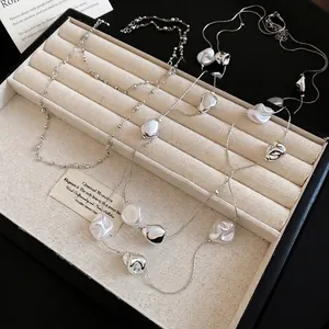 Three-layer vintage crystal pearl necklace with irregular liquid metal silver pendants