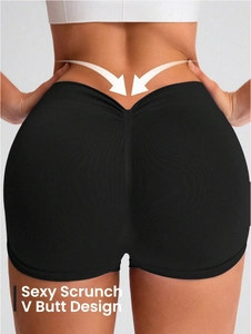 Detail of black seamless high waist yoga shorts with sexy scrunch V butt lifting design