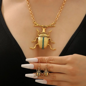Set gioielli vintage scarabeo oro con strass blu collana e orecchini pendenti