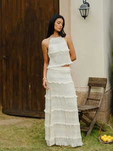 Elegant white halter top and tiered ruffle maxi skirt set for beach vacation wear