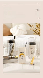 Three-in-one travel toothbrush cup set with cute cat pattern and functional dividers