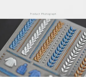 Macro view of 5D embossed nail stickers showing sweater knit texture and 3D patterns