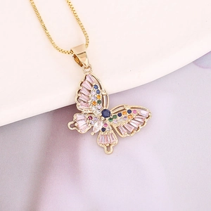 Detail of copper butterfly pendant with colorful zircons on a gold chain