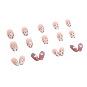Short ballet press-on nails with pink gradient, brown cow print, and 3D heart gems
