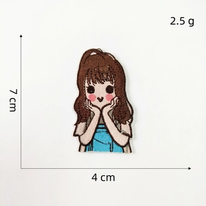 Detailed embroidery patch of cartoon girl showing dimensions 7x4cm and 2.5g weight
