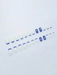Detailed flat lay of 24pcs blue star French fake nails with various sizes and star patterns