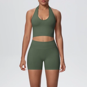 Detail of olive green ribbed halter yoga top and high-waist shorts seamless gym set