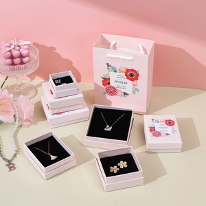 Pink marble jewelry box set with floral patterns for necklaces and elegant gift bags